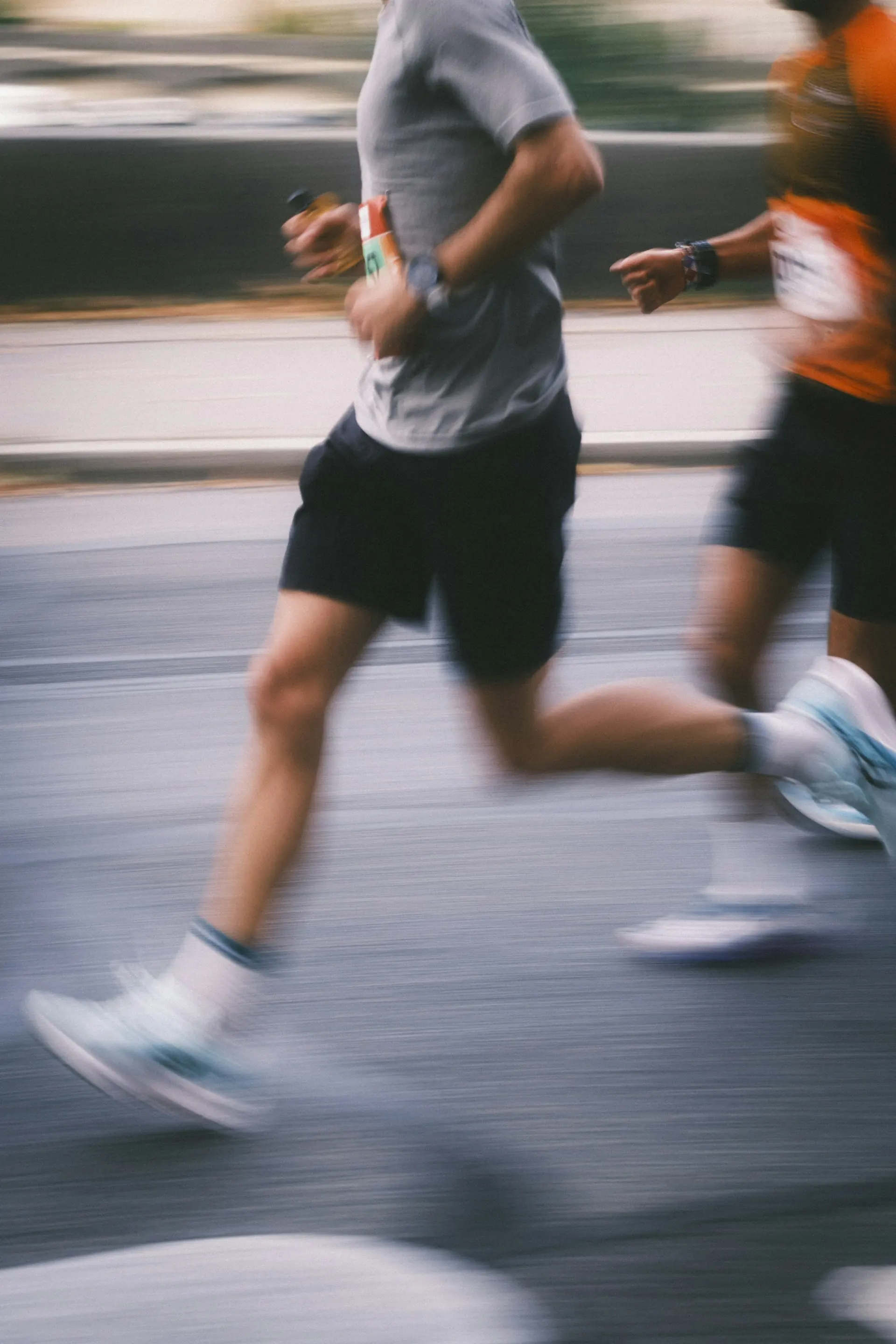 Runners in a race, blurred with motion.