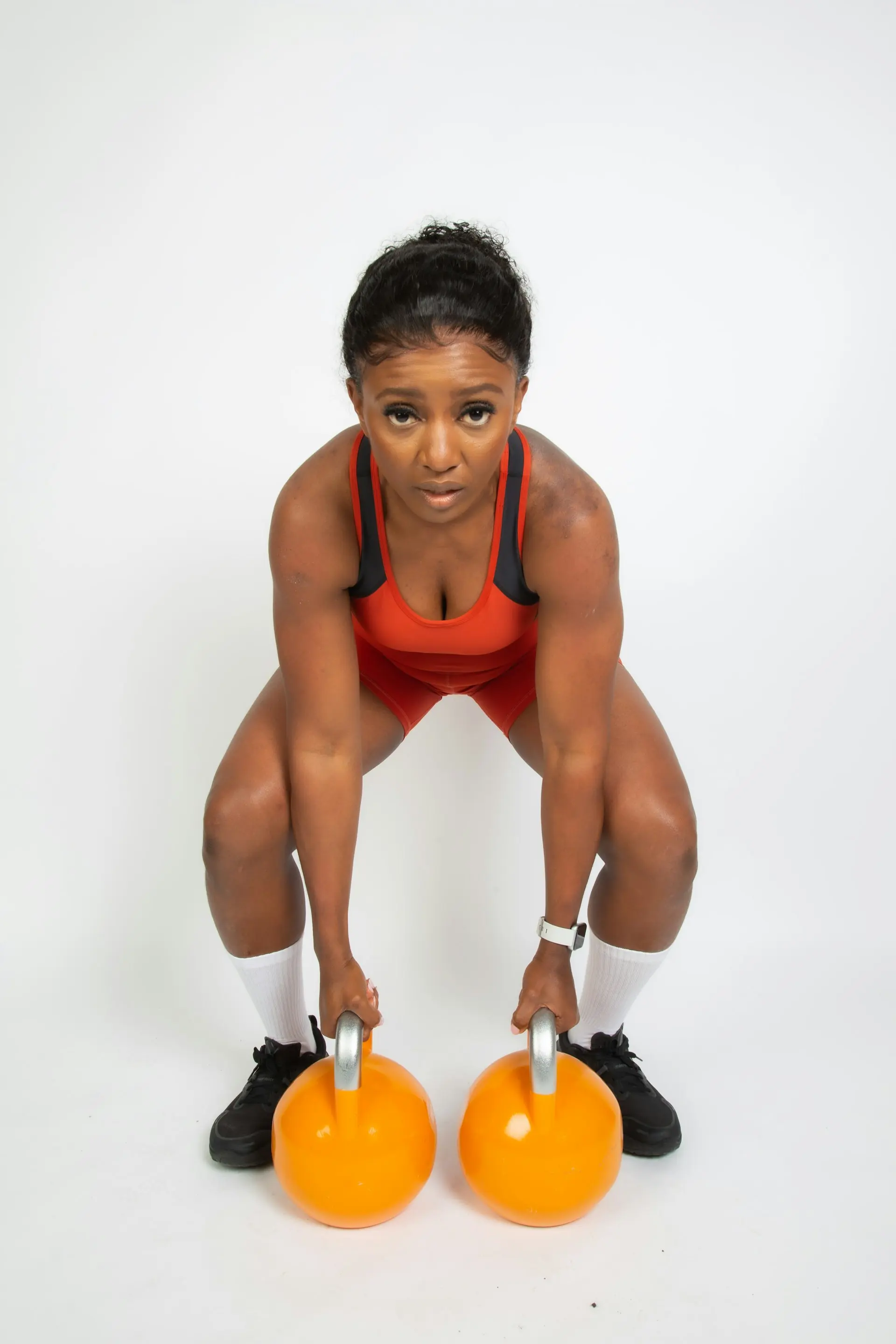 A woman working through a heavy set.
